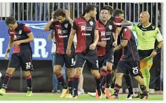 ??  ?? ON TARGET: Cagliari's Marco Sau, right, celebrates with his teammates after scoring a goal against Roma during the Serie A football match at the Sant'Elia stadium in Cagliari on Sunday night. (AFP)