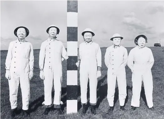  ??  ?? FACING THE CONSEQUENC­ES: Field trial personnel in 1956 work masks to allow the collection of proxy warfare substances sprayed from aircraft.