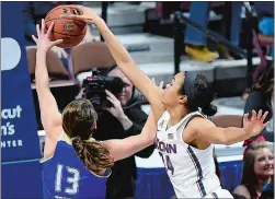  ?? SEAN D. ELLIOT/THE DAY ?? UConn’s Napheesa Collier blocks a shot by Tulsa’s Ashley Hughes (13) in an AAC tournament quarterfin­al on March 4 at Mohegan Sun Arena.