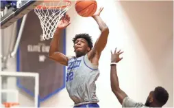  ?? JOE RONDONE/THE COMMERCIAL APPEAL ?? Memphis Tigers center James Wiseman blocks a shot during practice Tuesday.