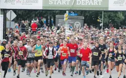  ?? PATRICK DOYLE ?? Runners leave the starting line on Sunday’s 10-K run.