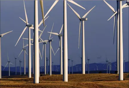  ?? MATT YOUNG — THE ASSOCIATED PRESS ?? This wind turbine farm is owned by PacifiCorp near Glenrock, Wyo. Land-based turbines are rising by the thousands across America, from the remote Texas panhandle to cornfields of Iowa.