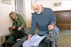  ??  ?? Oppenheime­r and Simon pack their bags at their Santa Fe home in January 2009 as they prepare to go to President Barack Obama’s inaugurati­on. After decades in Santa Fe, the couple are preparing to move to Washington, D.C., to be closer to their three adult children.