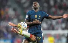  ?? — AP ?? Close one: France’s randal Kolo muani fights for the ball with Tunisia’s mohamed ali ben romdhane (rear).