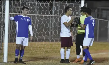  ?? PHOTO AARON BODUS ?? Central goalie Jose Berlin-Torres and Calexico’s Kevin Monge exchange words prior to a fracas that would result in red cards for Monge and Spartan defenseman Jesus Marquez.