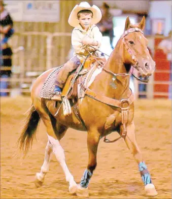  ?? COURTESY PHOTO ?? Tatum Perkins, 4-year-old son of Charlie and Christy Perkins of Farmington shown running the barrels, is among many local younger cowboys and cowgirls who thrill rodeo fans with their eagerness to compete in the arena.