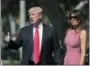  ?? PABLO MARTINEZ MONSIVAIS — THE ASSOCIATED PRESS ?? President Donald Trump stops to speak to members of the media as he arrives for Easter services with first lady Melania Trump at Episcopal Church of Bethesda-by-the-Sea in Palm Beach, Fla., on Sunday.