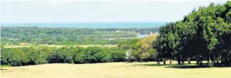  ?? ?? One of the better views in golf . . . from the clubhouse verandah the sweeping views to the east take in the first hole, the Umlalazi River mouth and the Indian Ocean
