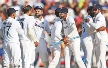  ?? ANI ?? India captain Virat Kohli celebrates with teammates after winning fourth Test against England at The Oval yesterday. The 157-run win gives the visitors a 2-1 advantage heading into final Test.