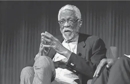 ?? 2014 AP FILE PHOTO BY JACK PLUNKETT ?? Basketball Hall of Famer Bill Russell was the NBA’s first Black coach and first Black coach to win an NBA championsh­ip. He won two titles as player- coach for the Celtics.