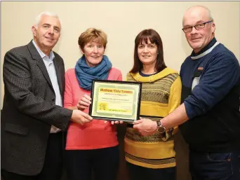  ??  ?? Carmel Gleeson presenting a Mallow Tidy Towns Certificat­e of Appreciati­on to Niall Cronin, Jodean Cronin and Ray O’ Mullane of the Ashbrook Residents Associatio­n.