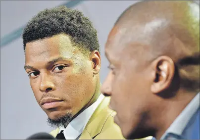  ?? CP PHOTO ?? Raptors point guard Kyle Lowry, left, looks as Raptors president Masai Ujiri speaks during a news conference in Toronto on Friday, July 7, 2017.