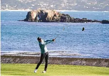  ?? ERIC RISBERG/ASSOCIATED PRESS ?? Jordan Spieth hits his approach shot to the 18th green during Saturday’s third round of the AT&T Pebble Beach Pro-Am. He has a twoshot lead going into Sunday’s final round.