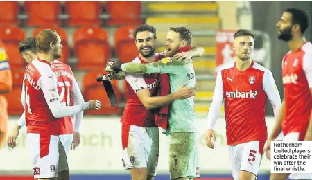  ??  ?? Rotherham United players celebrate their win after the final whistle.