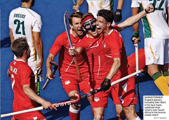  ?? GETTY IMAGES ?? BARNSTORME­R: England players, including Sam Ward in his face mask, celebrate their victory over South Africa in the bronze medal match