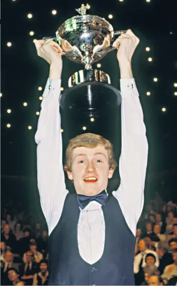  ??  ?? Top of the world: Steve Davis, at 23, celebrates the first of his six world titles at the Crucible in 1981