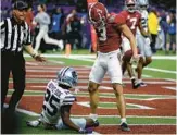  ?? CHRIS GRAYTHEN/GETTY ?? Alabama’s Jermaine Burton, right, stands over KSU’s Ekow Boye-Doe after scoring a touchdown in the Sugar Bowl on Saturday in New Orleans.