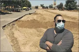  ??  ?? JESSIE CHAUHAN stands on the site along Highway 99 in Atwater that will become Rapid XPress Car Wash. Chauhan also owns a carwash in Merced.