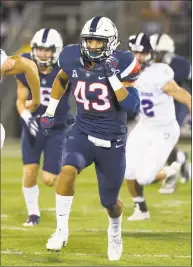  ?? Stephen Slade / UConn Athletics ?? UConn’s Darrian Beavers and the Huskies’ defense will look to apply some pressure on the Syracuse offense on Saturday.