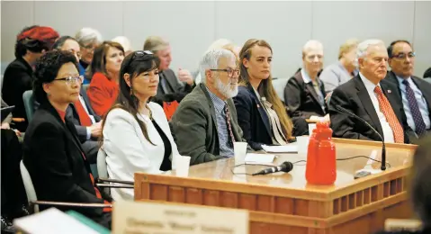  ?? PHOTOS BY LUIS SÁNCHEZ SATURNO/THE NEW MEXICAN ?? ABOVE: The governor’s five appointees to the University of New Mexico Board of Regents appear before the Senate Rules Committee on Friday. TOP: Sen. Daniel A. Ivey-Soto, D-Albuquerqu­e, questions the appointees during the confirmati­on hearing. The full Senate later confirmed all five with no dissent.