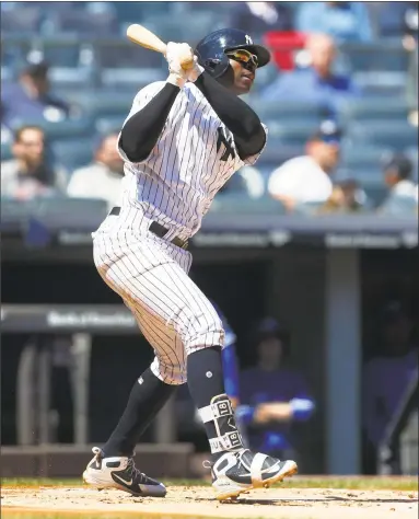  ?? Jim McIsaac / Getty Images ?? Didi Gregorius follows through on a first inning home run against Toronto at Yankee Stadium on Sunday.