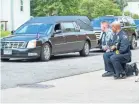  ?? JASPER COLT/USA TODAY ?? Minneapoli­s police officers take a knee outside a memorial service for George Floyd last June.