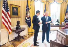  ?? ANDREW HARNIK/ASSOCIATED PRESS ?? President Donald Trump speaks to White House Senior Adviser Jared Kushner, left, in the Oval Office in Washington on Friday. Saturday marks the president’s first 100 days in office.