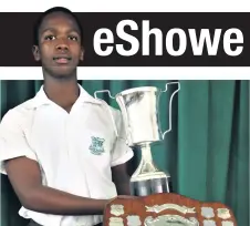  ??  ?? Sphephelo Cele with the Bozas Shield for outstandin­g achievemen­t in sport and trophies for rugby player of the year and boys best all rounder