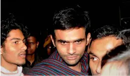  ?? —PTI ?? JNU student Umar Khalid, who is facing charges of sedition, comes out of JNU campus to surrender before the police in New Delhi