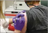  ?? UNIVERSITY OF MARYLAND SCHOOL OF MEDICINE VIA AP ?? In this May 4 photo, the first patient enrolled in Pfizer’s COVID-19 coronaviru­s vaccine clinical trial at the University of Maryland School of Medicine in Baltimore receives an injection.