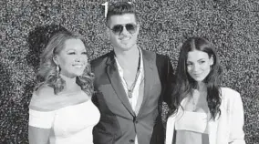  ?? KEVIN RICHARDSON/BALTIMORE SUN ?? Vanessa Williams, from left, Robin Thicke and Victoria Justice at Pimlico on Saturday.