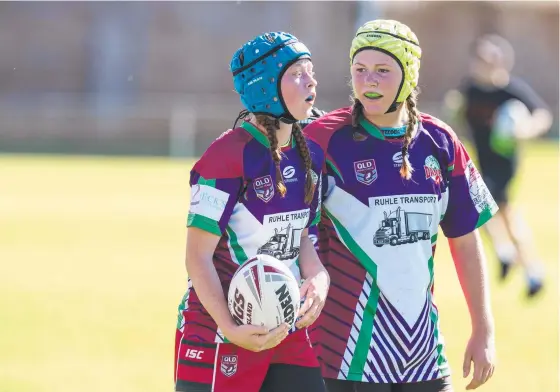  ?? Picture: Kevin Farmer ?? ALL SMILES: Pittsworth Danes players Ella Hollis (left) and Ella O’Dea celebrate a big play in the TJRL U15s grand final.