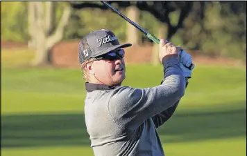  ?? CLIFF HAWKINS / GETTY IMAGES ?? Charley Hoffman fired a 6-under 66 on Friday to take the lead in the Arnold Palmer Invitation­al at Bay Hill. Emiliano Grillo is one stroke back.