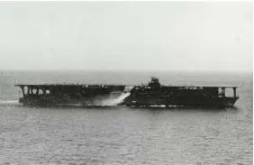  ?? NAVAL HISTORY AND HERITAGE COMMAND VIA AP ?? Above: The Japanese aircraft carrier Kaga is shown at sea in the 1930s. Right: In 1944, Julian and Jacqueline Hodges pose for a portrait on their wedding day in Lewiston, Mont.