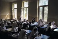  ?? (AP/Felipe Dana) ?? Girls prepare for class Sept. 12 at a school in Kabul.