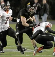  ?? Photo by Bob Raines ?? Wood’s Andrew Guckin cuts between two defenders in the Vikings’ loss to Cathedral Prep Dec. 14 in the PIAA Class AAA title game.