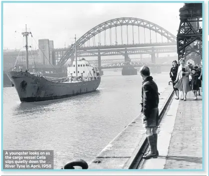  ??  ?? A youngster looks on as the cargo vessel Celia slips quietly down the River Tyne in April, 1958