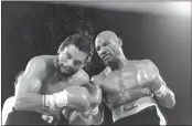  ?? THE ASSOCIATED PRESS FILE ?? Marvin Hagler pounds challenger Roberto Duran in the ninth round of a Novembeer 1983 boxing bout in Las Vegas. Hagler scored a unanimous decision over Duran. Hagler, the middleweig­ht boxing great whose title reign and career ended with a split-decision loss to Ray Leonard in 1987, died Saturday.