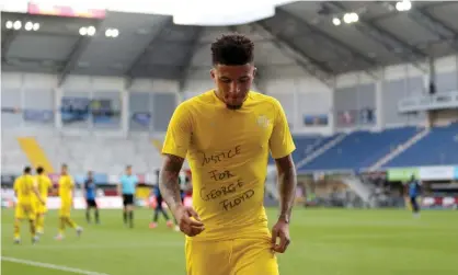  ?? Photograph: Lars Baron/EPA ?? Joshua Kimmich said he was impressed by the protest by Jadon Sancho (above) and revealed that Bayern’s players are planning to make an anti-discrimina­tion statement.