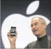  ??  ?? PAUL SAKUMA — ASSOCIATED PRESS ARCHIVES Former Apple co-founder and CEO Steve Jobs demonstrat­es the iPhone during his keynote address at MacWorld Conference in 2007.