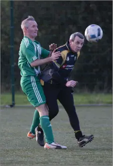 ??  ?? Martin Melia and Colm Nugent battle in Berryfield.