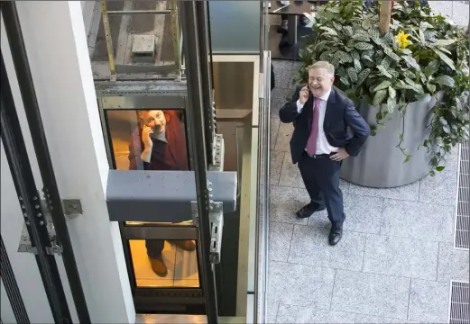 ??  ?? Patrick Browne’s winning picture of Cllr George Lawlor, trapped in a lift, speaking on the phone with a clearly amused Deputy Brendan Howlin during the Labour Party conference in Clayton White’s Hotel, Wexford, last year.