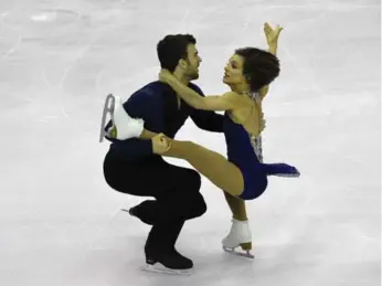  ?? LLUIS GENE/AFP/GETTY IMAGES ?? Meagan Duhamel said she and pairs partner Eric Radford were “not machines” after a rare second-place finish.