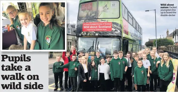  ??  ?? Wild about nature Excited youngsters line up to board the double- decker