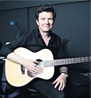  ??  ?? Never giving up: Rick Astley today, with a new album out; below, in the Eighties; left, performing last year with Dave Grohl at Cal Jam in California