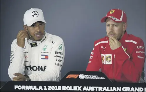  ??  ?? 0 Lewis Hamilton and Sebastian Vettel at a press conference after a Mercedes team mistake allowed the German to drive to victory.