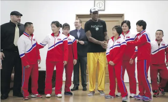  ?? PHOTOS: KIM KWANG HYON/THE ASSOCIATED PRESS ?? Former basketball star Dennis Rodman poses with North Korean Olympic athletes on June 15 during a visit to Pyongyang, North Korea.