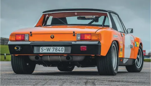  ??  ?? Above: With rear valance removed, heat build up was reduced. ‘Straightth­rough’ R-style muffler emits a sound to die for
Below left: Cross-bracing in rear luggage bay ties anti-roll bar mounts into shock towers. Note lightweigh­t boot lid, from balsa-reinforced glassfibre