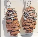  ?? ?? Madison Denton says she started making pinecones just as something different to sell at the market. She started by making four or five pairs and took them to sell at the Musquodobo­it Harbour Farmers Market.