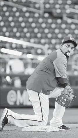  ?? PATRICK SEMANSKY/AP ?? Third baseman Anthony Rendon participat­es in a workout Friday as the Nationals await the winners of the AL Championsh­ip Series.